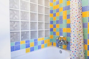 Combined shower/tub, hair dryer
