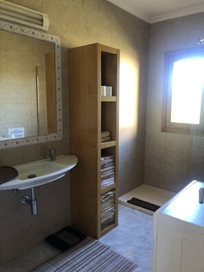 Shower, hair dryer, towels, soap