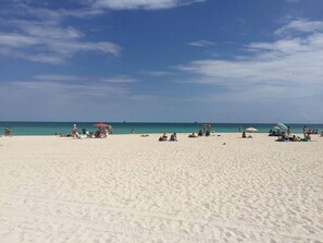 On the beach, sun loungers, beach towels