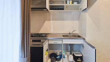 Family Condo, Non Smoking | Private kitchen | Full-size fridge, microwave, stovetop, electric kettle