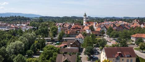 A town with traditional architecture, including a prominent tower and a mix of residential and commercial buildings.
