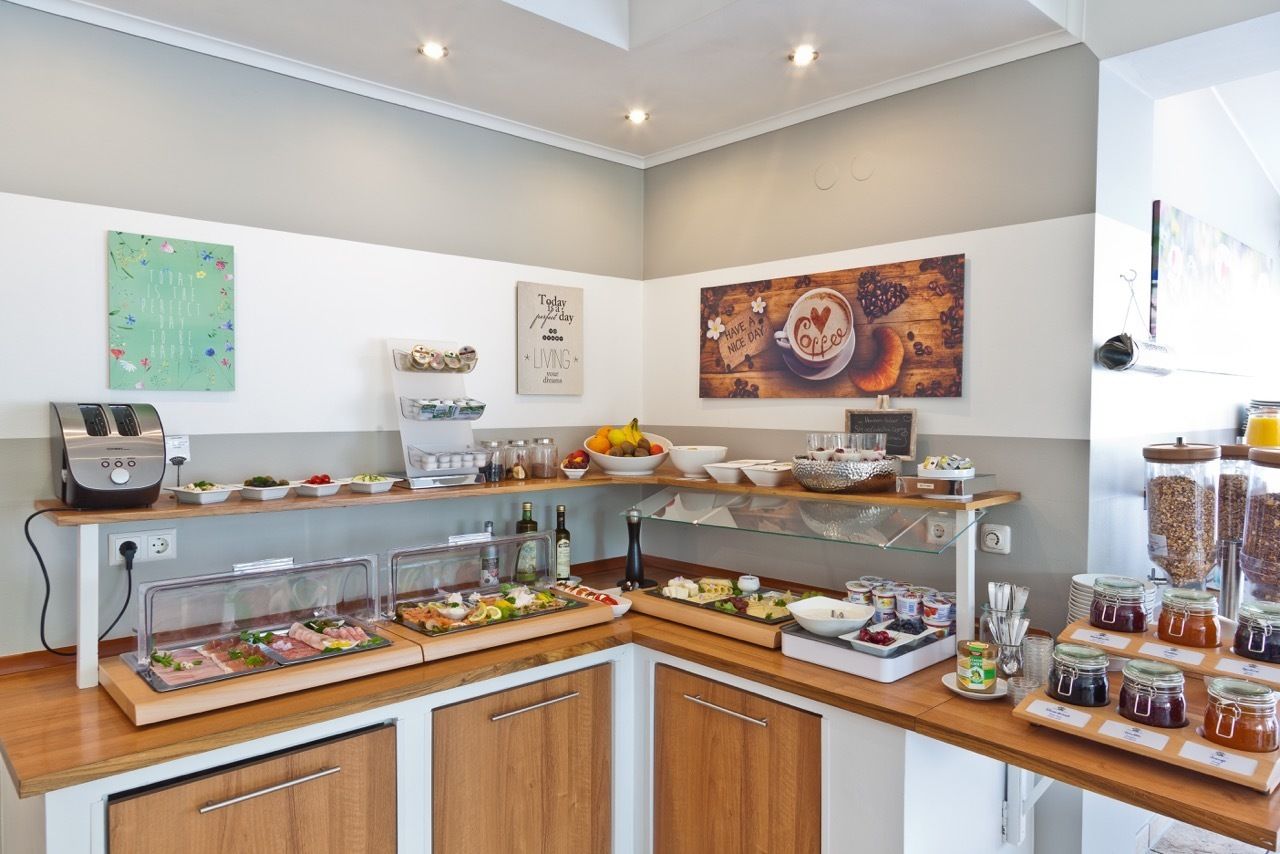 A breakfast buffet with various food items and condiments.