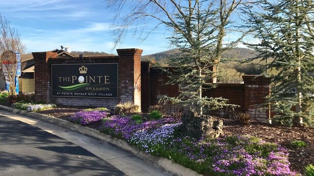 A sign for The Pointe at Pointe Royale Golf Village. - 3 bedroom, 3 bath, indoor and outdoor pools, 2nd floor in gated Pointe Royale (Branson)
