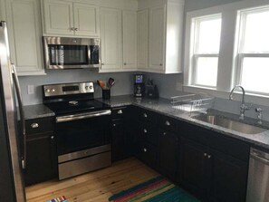 Fridge, microwave, oven, stovetop - Discover 'Best Day Ever': 4BR, 3BA beach house on Holden Beach, perfect for family fun! (Holden Beach)