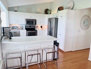 Fridge, microwave, oven, stovetop - Experience bliss at Carpe Diem, a spacious 4-bedroom home in Holden Beach. (Holden Beach)