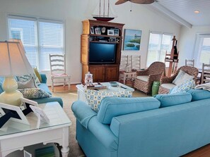 TV, fireplace - Experience bliss at Carpe Diem, a spacious 4-bedroom home in Holden Beach. (Holden Beach)