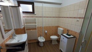 A bathroom with a sink, toilet, bidet, and a small cabinet. - Apartment in Rovinj with Terrace, Air condition, WIFI (3483-4) (Rovinj)