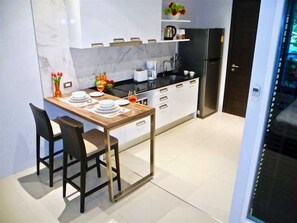 Fridge, microwave, stovetop, coffee/tea maker