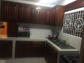 Microwave, coffee/tea maker, cookware/dishes/utensils
