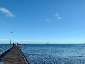 A pier extending into calm waters with a clear sky. - Sunryes Beach House @the Heart of Rye Beach & Shops: Longer Stay Welcome (Rye)