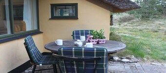 Acogedora casa de vacaciones de piedra en parcela de dunas, con WiFi y horno