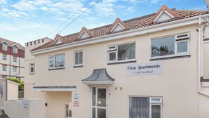 A two-story building with a sign reading "Vista Apartments 17 Alta Vista Road." - Ideally positioned apartment with large balcony overlooking Goodrington Beach. (Paignton)