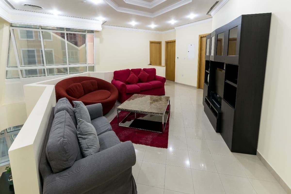 Chambre Deluxe, 1 grand lit 1 place, non-fumeur, vue mer | Coin séjour