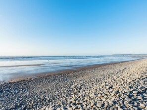 A pebble beach with a clear sky. - 3 bedroom accommodation in Westward Ho! (Westward Ho!)