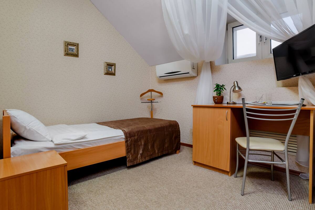 Economy Single Room, 1 Bedroom, City View | Hypo-allergenic bedding, blackout drapes, iron/ironing board