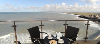 Panoramic views over the beach from a stylish apartment in a landmark building.