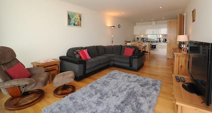 Panoramic views over the beach from a stylish apartment in a landmark building.