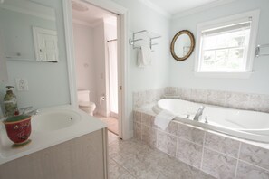 Bathtub, eco-friendly toiletries, hair dryer, towels
