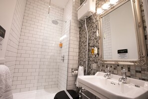 Shower, hair dryer, bathrobes, towels