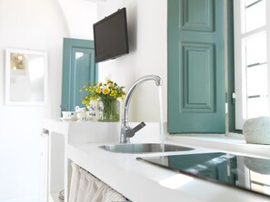 Fridge, coffee/tea maker, toaster, cookware/dishes/utensils