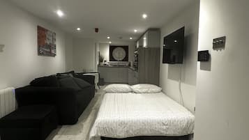 1 bedroom, desk, iron/ironing board, travel crib