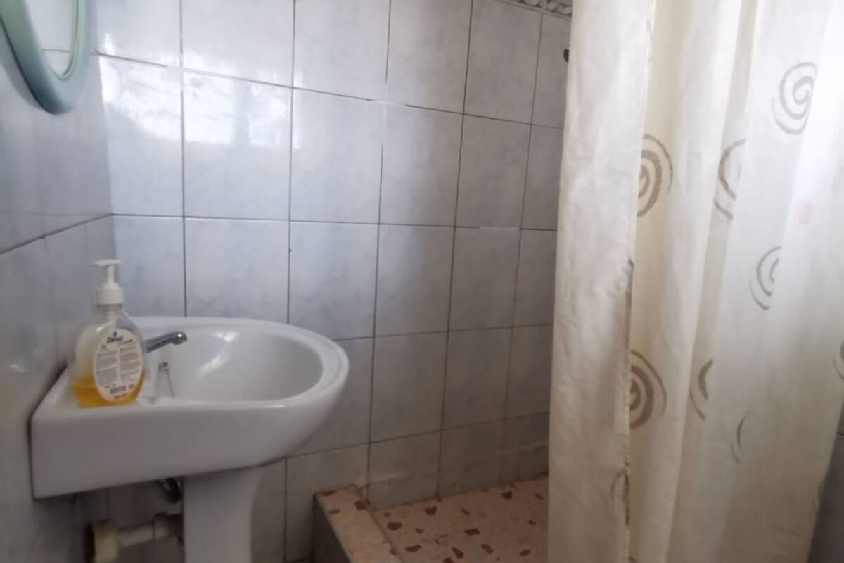 economy double room | bathroom | combined shower/bathtub, designer toiletries, towels, soap