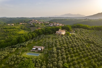 Aerial view of the house and pool set in its estate of 1500 olive trees