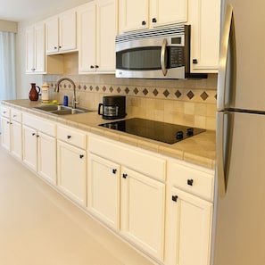 Fridge, microwave, stovetop, coffee/tea maker