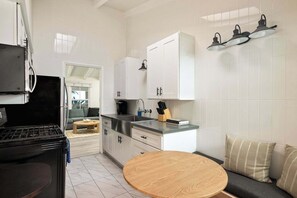 Coffee/tea maker, cookware/dishes/utensils, dining tables