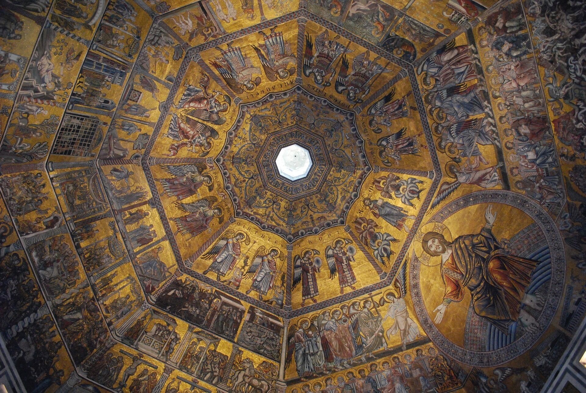 A detailed mosaic ceiling with religious figures and scenes.