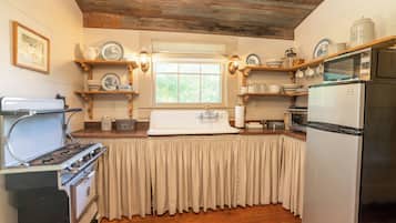 Fridge, microwave, coffee/tea maker, cookware/dishes/utensils