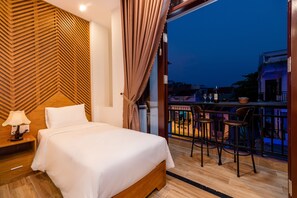 Deluxe Triple Room, Balcony, City View | 1 bedroom, minibar, desk, laptop workspace - Phong Phu Villa Hoi An (Da Nang)