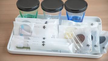 A tray with dental hygiene products including toothbrushes, toothpaste, and mouthwash.