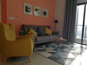 2 Bedrooms (Modern & Cozy) | Living room | 40-inch flat-screen TV with cable channels, TV