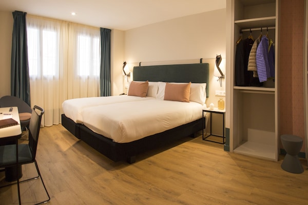 Deluxe Double Room, City View | Minibar, in-room safe, desk, blackout drapes