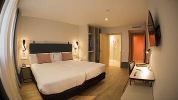 Double Room | Minibar, in-room safe, desk, blackout drapes