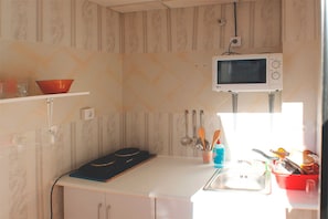 Réfrigérateur dans l'espace commun, micro-ondes dans l'espace commun