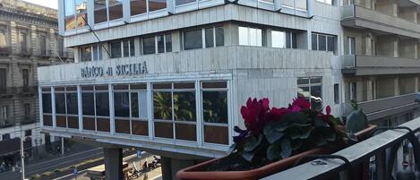 A multi-story building with a sign reading "BANCO DI SICILIA".