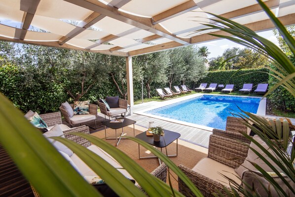 Seasonal outdoor pool, pool umbrellas, pool loungers