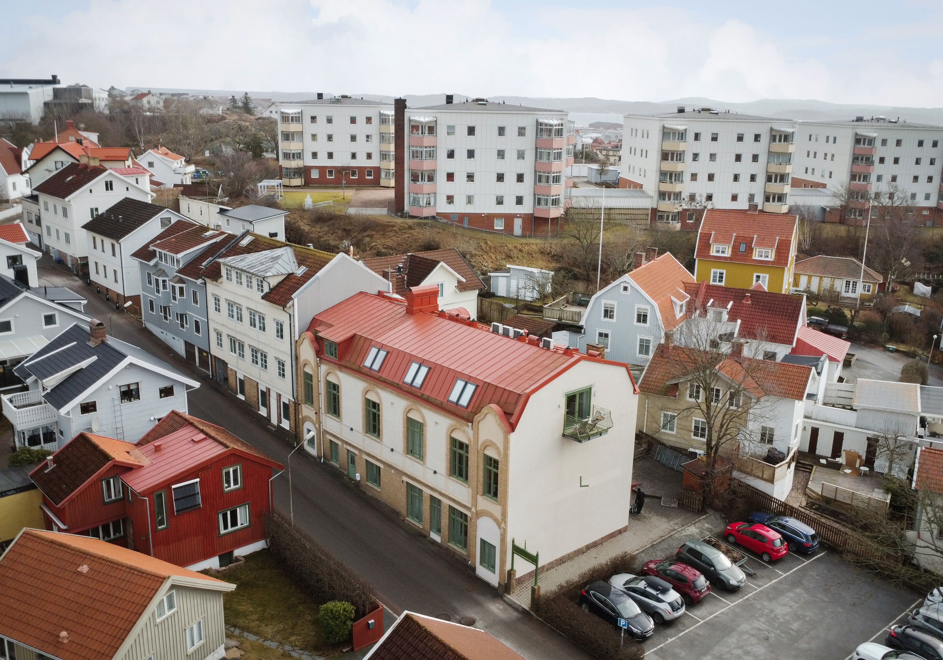 A residential area with various buildings, including multi-story apartment complexes and single-family homes.