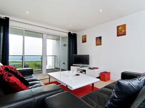 Living area - A luxury apartment with views over the golf course down to Fistral Beach. (Newquay)
