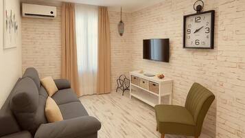 Appartement Deluxe, patio, vue jardin (Ground Floor) | Coin séjour | Télévision à écran plat