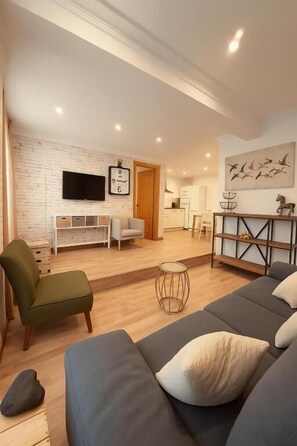 Deluxe Apartment, Patio, Garden View (Ground Floor) | Living area | Flat-screen TV - Apartamentos Sevilla Palace (Seville)