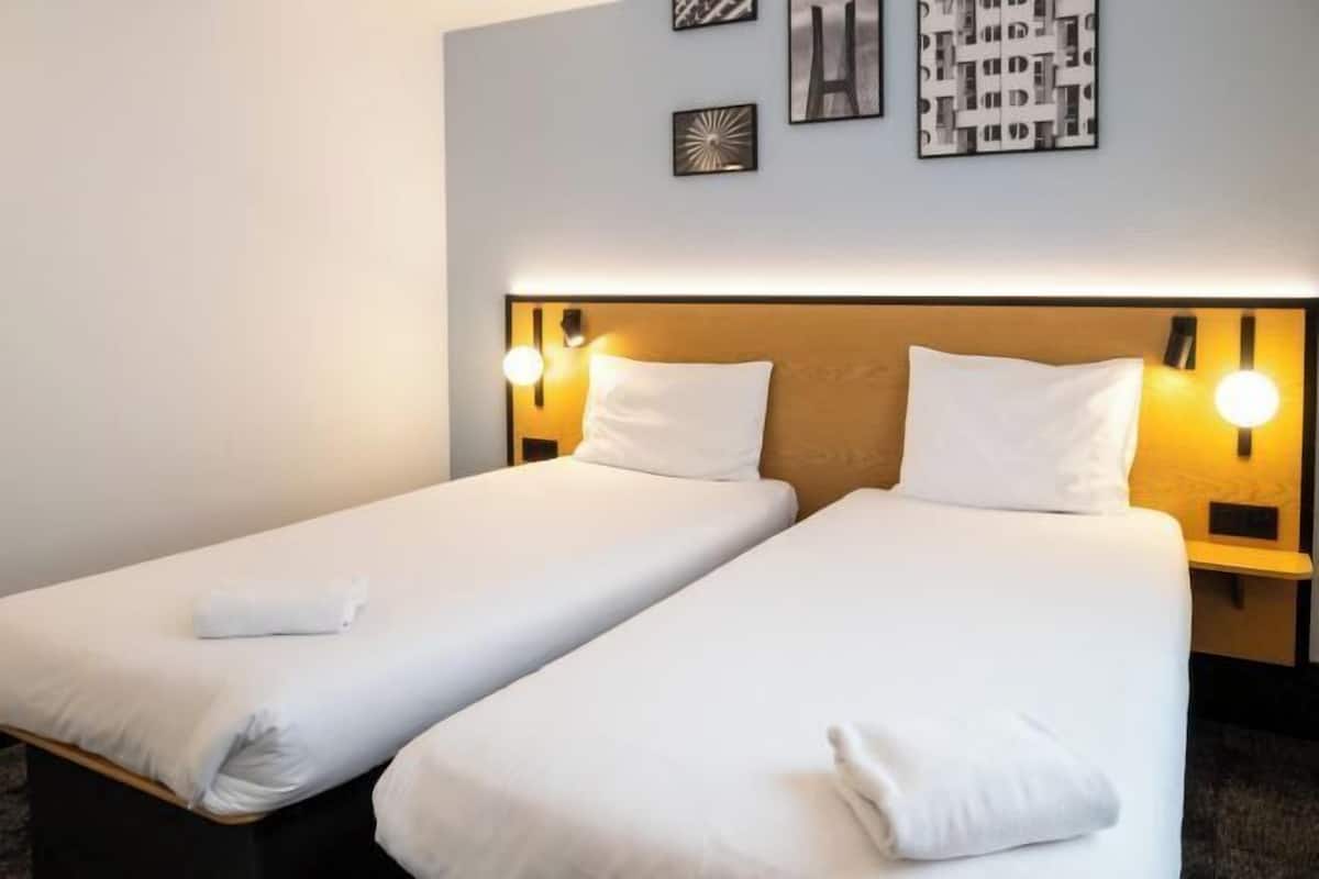 Desk, blackout drapes, WiFi (free), bed sheets