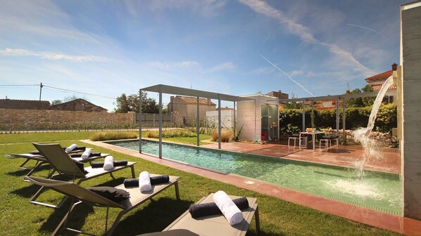 Outdoor pool, pool umbrellas, sun loungers