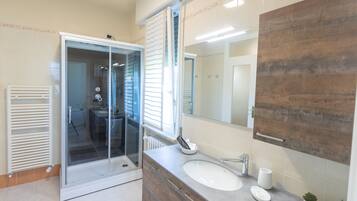 Shower, hair dryer, bathrobes, slippers