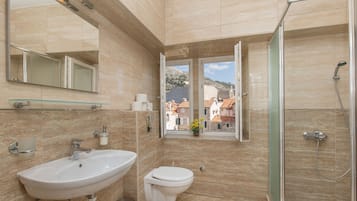 Classic Studio | Bathroom | Shower, hair dryer, towels, soap