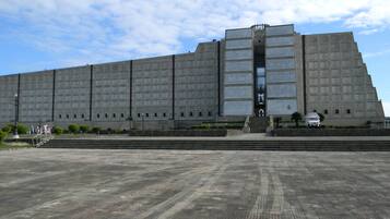 A large, rectangular building with a flat roof and a central entrance.