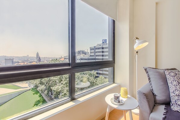 Apartment, 1 Bedroom | Living area | 100-cm flat-screen TV with cable channels, TV