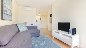 Apartment, 1 Bedroom | Living room | 100-cm flat-screen TV with cable channels, TV
